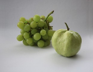 grapes and guava on white background