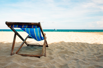 Chair on a sandy beach by the sea