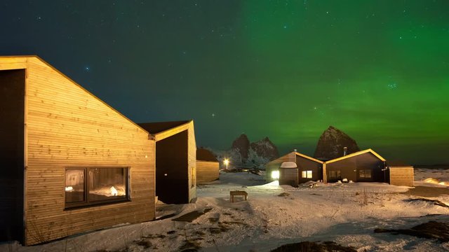 Time lapse of northern lights (aurora borealis) over modern architecture in Tr&aelig;na archipelago, Nordland, Norway