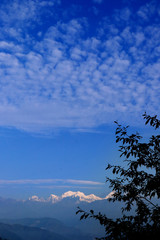 Kanchanjungha during golden hour, snow, peak, landscape, nature, Himalayan. Snowy mountains of Himalaya. A beautiful snowy mountain landscape under a blue cloudy sky..