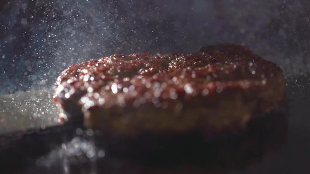 Cooking beef and pork patty for burger. Meat roasted at kitchen. Slow motion.