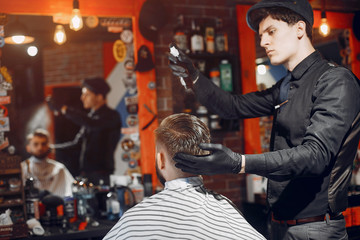 Man with a beard. Hairdresser with a client.