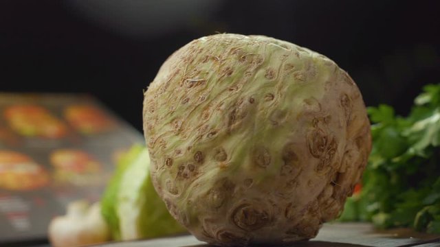 Fresh celery root on table slow zoom out