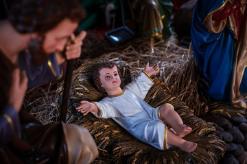 Traditional Christmas scenes and sacred light shining for use in illustration design Nativity scenes with Jesus baby on the manger with carvings, including Jesus, Mary, Joseph, sheep and magi