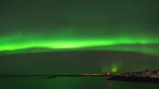 Time lapse of northern lights (aurora borealis) over skerries in Tr&aelig;na archipelago, Nordland, Norway
