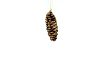 Hanging christmas fir cone on white background. Greeting card. New Year's holidays.