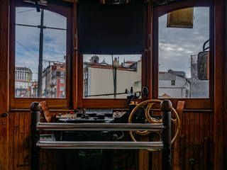 Porto, Purtugal. 16 November 2019. Detail of the driver's stand inside a traditional streetcar.