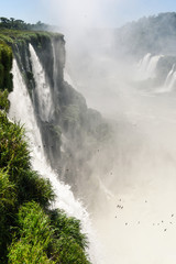 Famous Iguazu falls and beautiful Devil's throat waterfall. Declared a World heritage and one of the seven Natural Wonders of the World Brasil Argentina. Iguazu National Park vertical