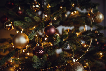 Beautifully decorated Christmas tree, closeup. balls and garlands