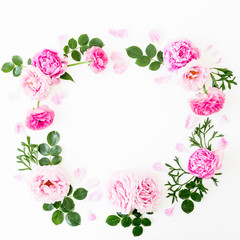 Floral frame made of pink flowers isolated on white background. Flat lay