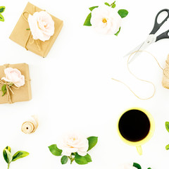 Frame composition with roses, gifts, scissors, coffee mug isolated on white background. Flat lay, top view.