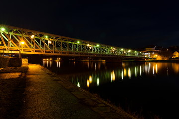 Old iron Bridge over Vltava river in Tyn nad Vltavou, Czech Republic.