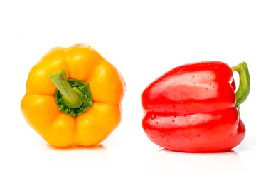 Two red and yellow Fresh pepper are isolated in  white background.