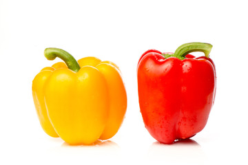 Two red and yellow Fresh pepper are isolated in  white background.