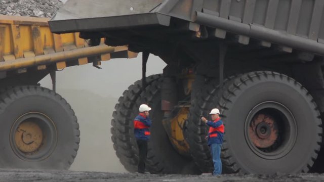 Mining dump trucks in the open pit mine, heavy truck in coal mine