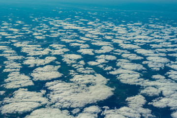 View from the airplane window on clouds and Europe