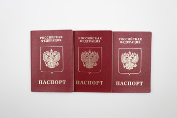 Three Russian passports on a white background.