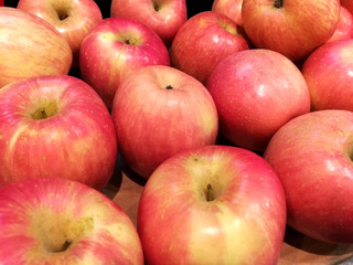 Closeup and crop heap of Red apples on sell in the market.
