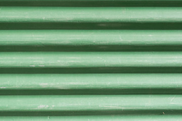 Close up of bright green tile roof surface, abstract background texture