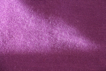 Colorful pink natural nepalese pashmina fabric. Herringbone tweed, Virgin Wool Background Texture. Expensive material. High resolution. Pashmina is a fine type of cashmere wool. Light falls on fabric.