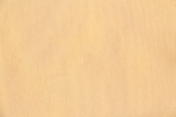 Light yellow silk fabric. Textile Background Texture. Expensive material. High resolution.