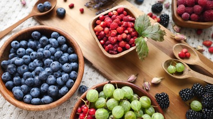 Ripe And Sweet Berries In Bowl On Wooden Table. Healthy Eating.