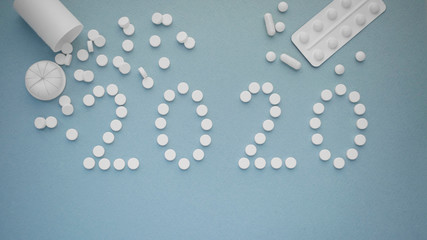 2020 Year with a jar of pills. New Year and Christmas medical and pharmaceutical background