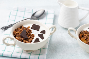 Obraz na płótnie Canvas Granola, oatmeal with chocolate food background