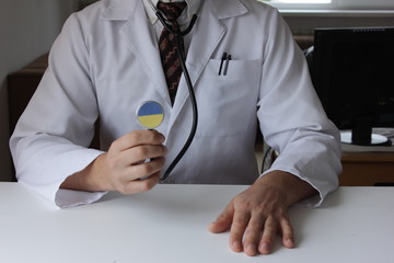 Obraz na płótnie Canvas Doctor holding stethoscope with flag series - Ukraine
