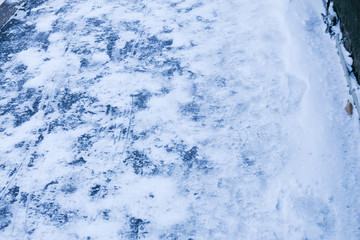 Stone pavement covered with snow