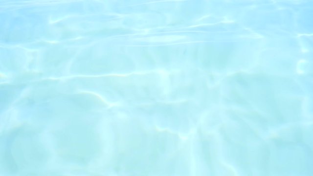 Pure blue water in the Pacific Ocean with light reflections. Slow motion.