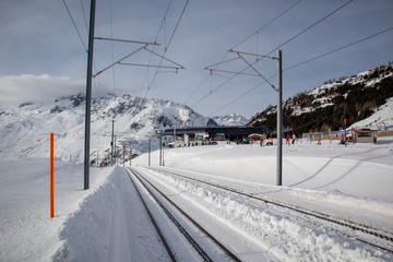 Railway in Switzerland in winter with rack rails and snow 
