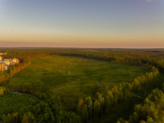 Aerial view of cleared plot of wood for new budget housing on city outskirts