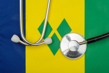 Flag of Saint Vincent and the Grenadines and stethoscope. The concept of medicine.