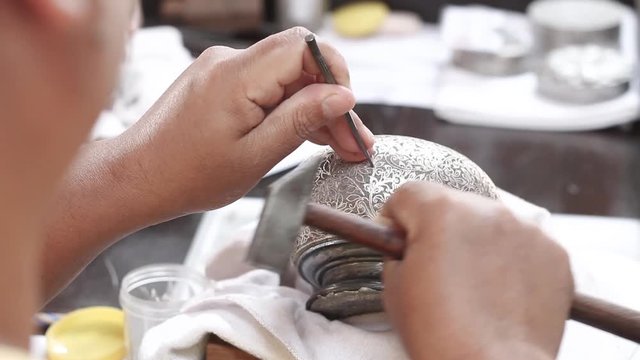 Ktram is the technique of inlaying fine silver or gold threads, beating them into designs on an iron surface. "Khram Work" one of the high class handicraft in thailand.