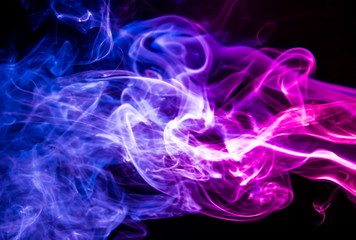 Colored smoke on black background
