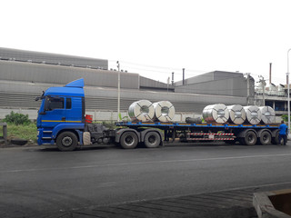 Large flat coil steel trailer truck for delivery to customers