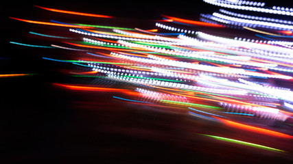 Neon lights. Dark background, abstract light. Blurred bokeh background.