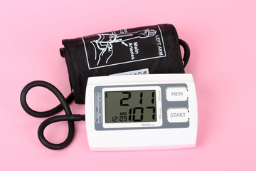 electronic blood pressure meter and red heart