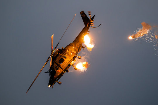 SANICOLE, BELGIUM - SEP 13, 2019: Belgian Air Force Agusta A109 helicopter firing flares during a flight demonstration at the Sanice Sunset Airshow