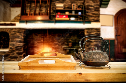 Metal Kettle On Wooden Table Free Space For Your Decoration Blurred Background Of Fireplace With Orange Fire Cold December Night In Home Interior Hot Drink Tea Coffee Or Mulled Wall Mural Magdal3na - Metal Kettle For Fireplace
