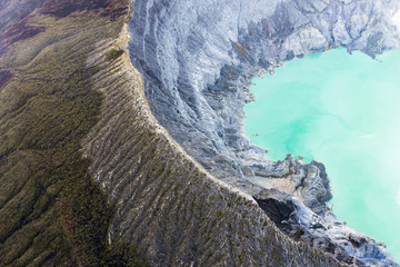 View from above, stunning aerial view of the Ijen volcano with the turquoise-coloured acidic crater...