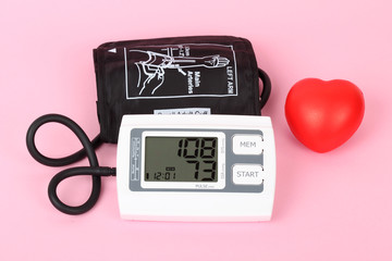 electronic blood pressure meter and red heart