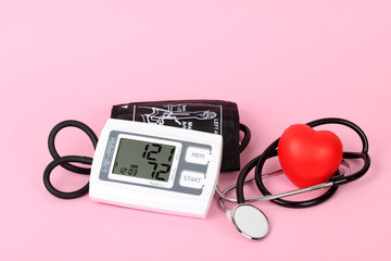 electronic blood pressure meter and red heart