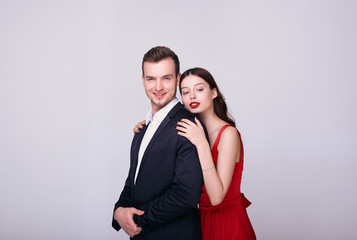 Portrait of a stylish young couple on a white background.