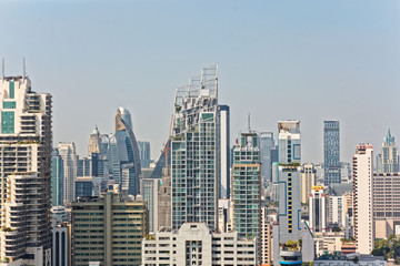 Bangkok, Thailand – December 22, 2019 : Office Buildings, city and condominiums Area in Bangkok, Office Building in City, Modern Building, Businesses Building. Sky view from Asoke area. with blue sky.
