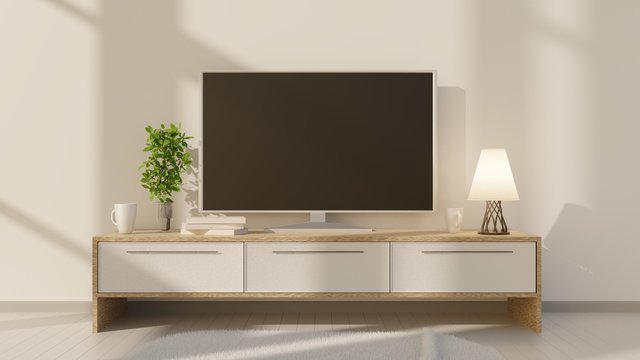 TV on a low table in the interior of the room with a white brick wall. 3D rendering. 3D illustration.