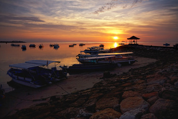 sunrise over fishing boats on Bali