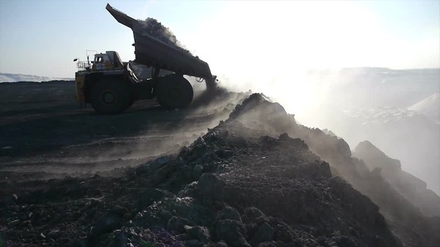 Mining dump trucks in the open pit mine