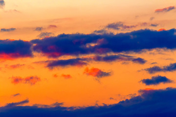 orange sunset sky with clouds. beautiful nature background